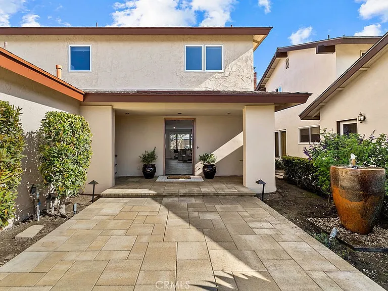 Entry courtyard with paved walkway